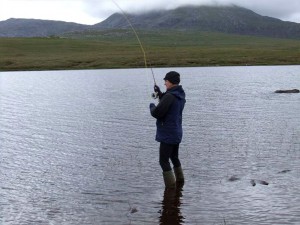 Here I am fishing for trout in typical Midsummer’s Day weather in the very Far North. The hill in the background is Foinaven, one of the finest peaks in Scotland, despite being 12 feet short of Munro status.